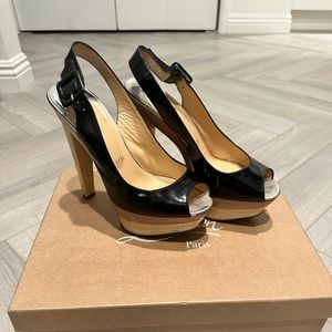 CHRISTIAN LOUBOUTIN
Patent Leather Slingback Platform Heels